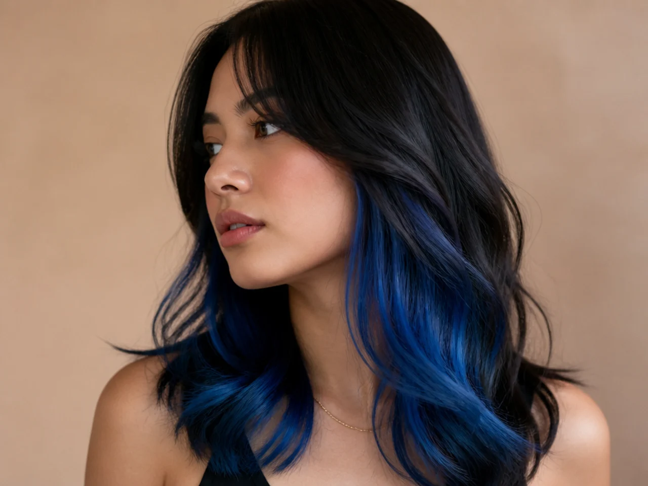 A blue peekaboo panel fading from dark roots to bright ends