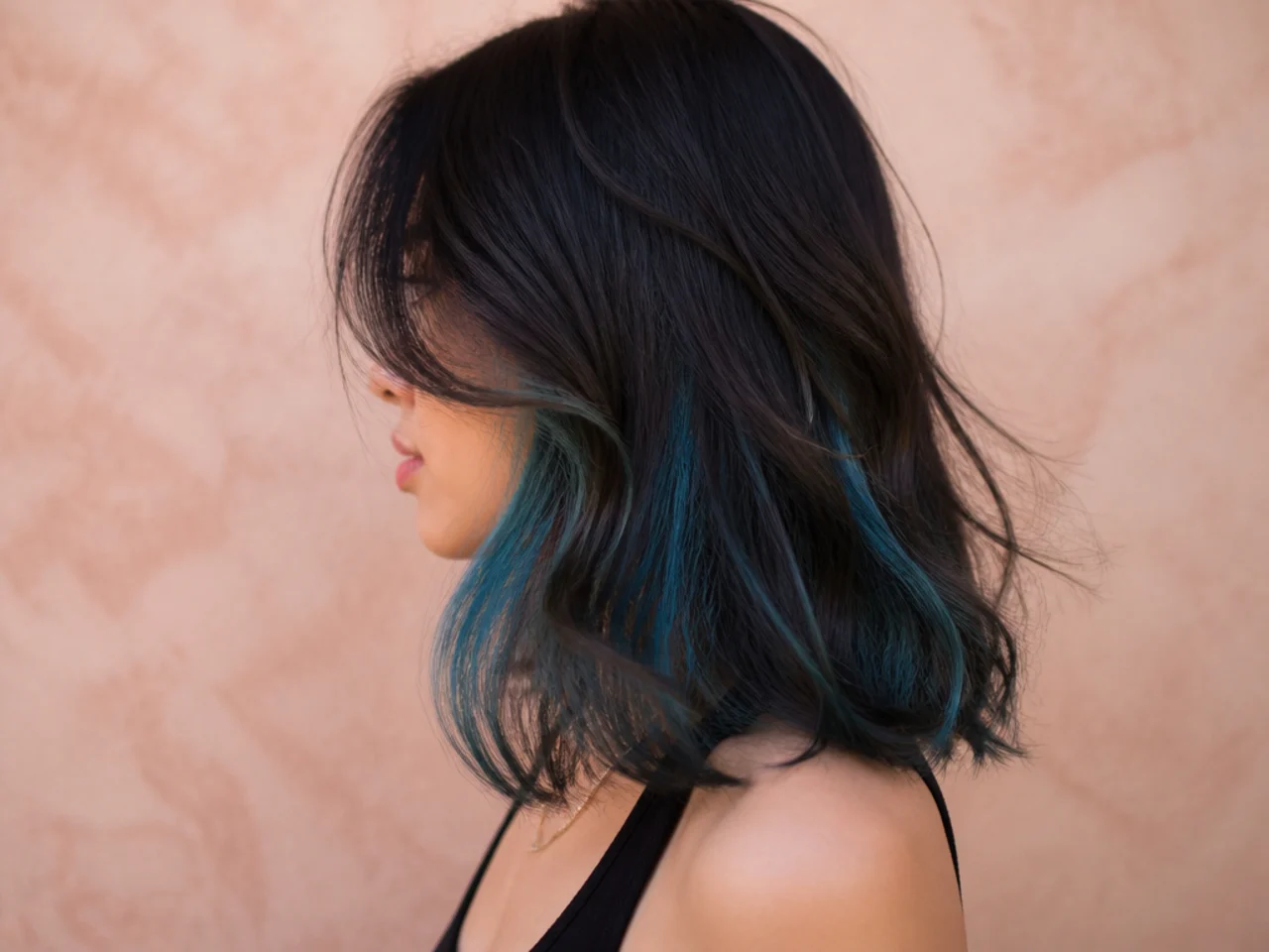 A blue peekaboo panel faded to teal after several weeks