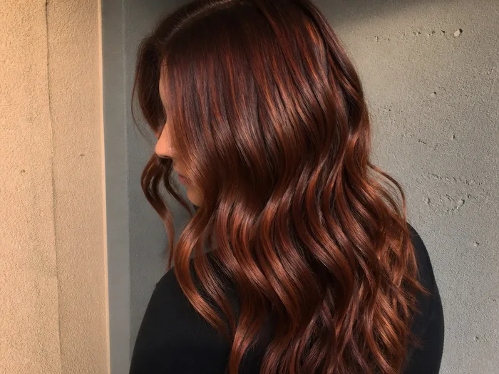Cinnamon cherry cola hair with warm copper red tones