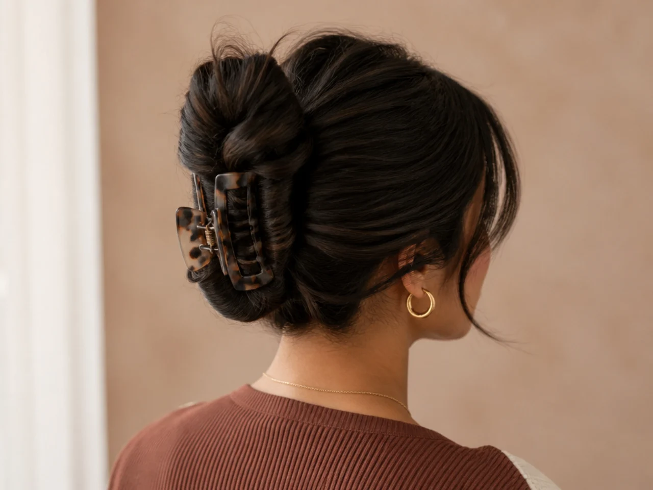 Thick hair coiled in two sections into one bun