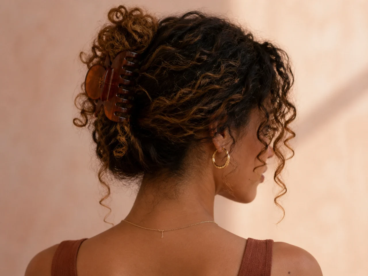 A clipped curly style with face-framing coils released