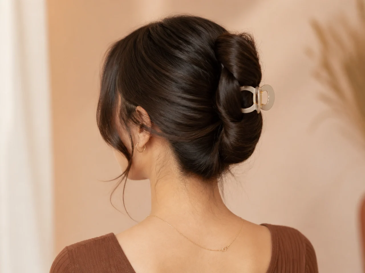 A double-wrapped bun secured with a clip
