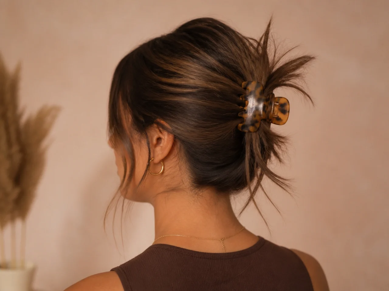 A messy clipped bun with ends left out