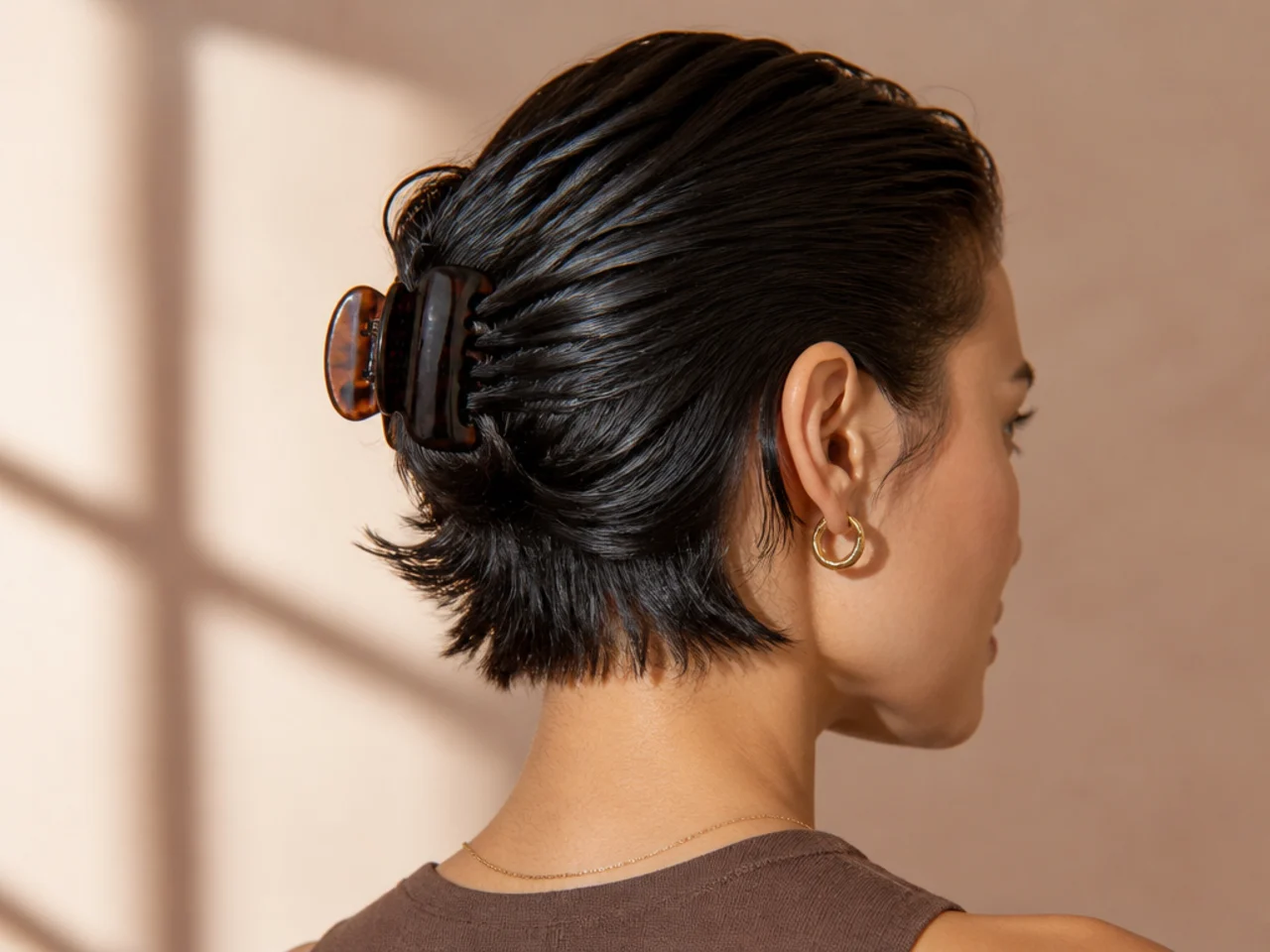 Wet-look short hair clipped flat