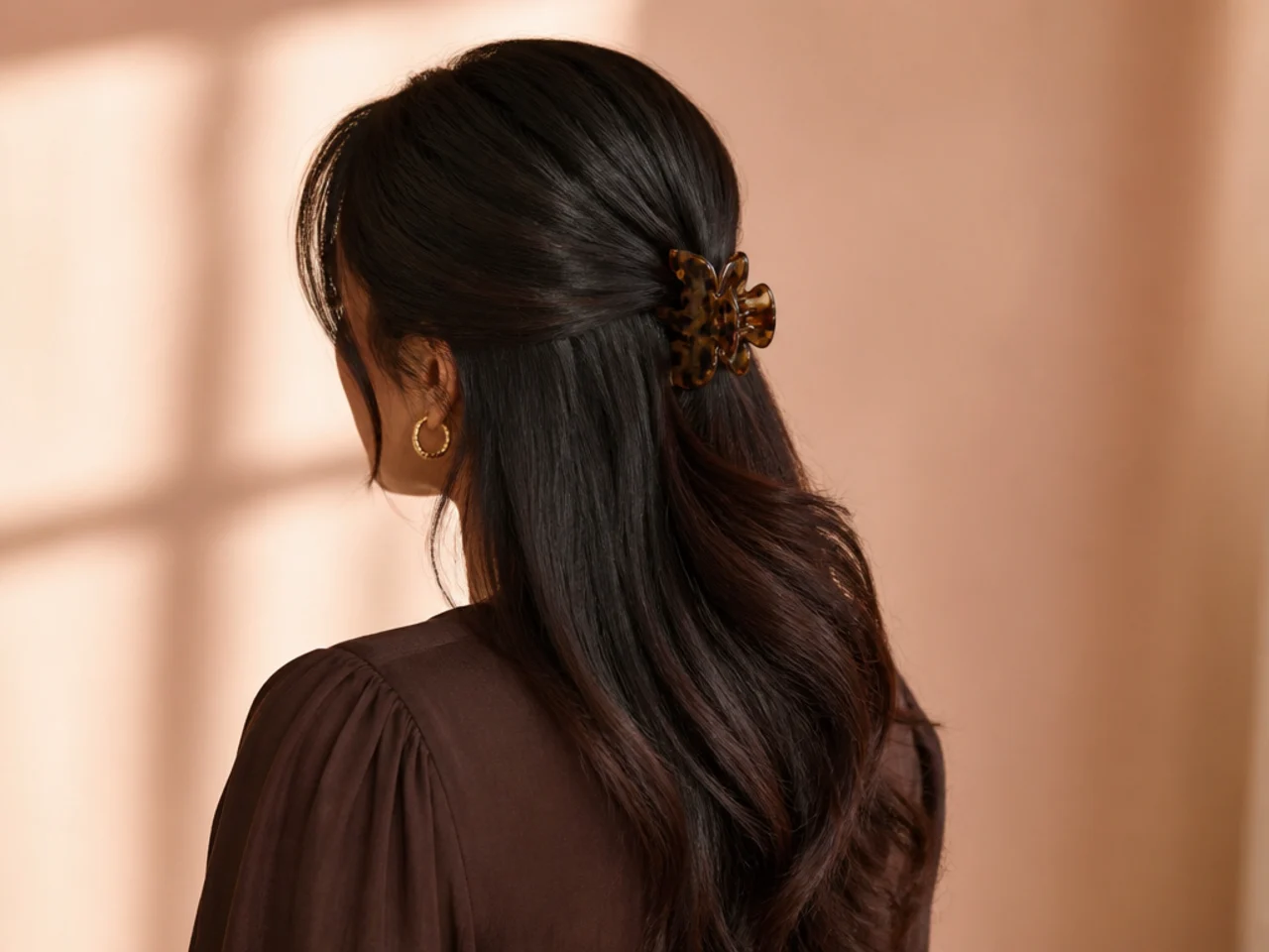A decorative clip worn with hair down