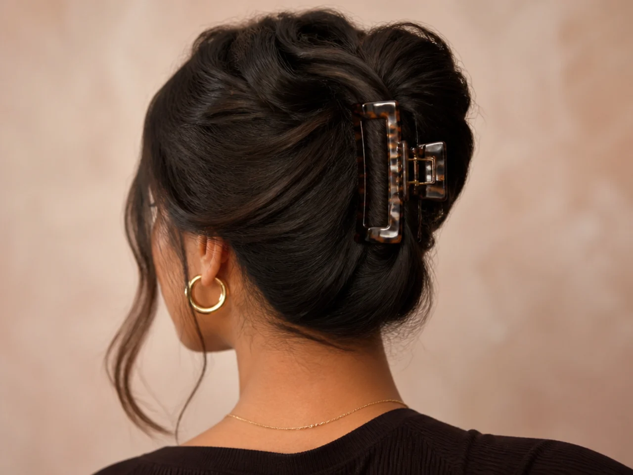 Thick hair split into two sections and clipped