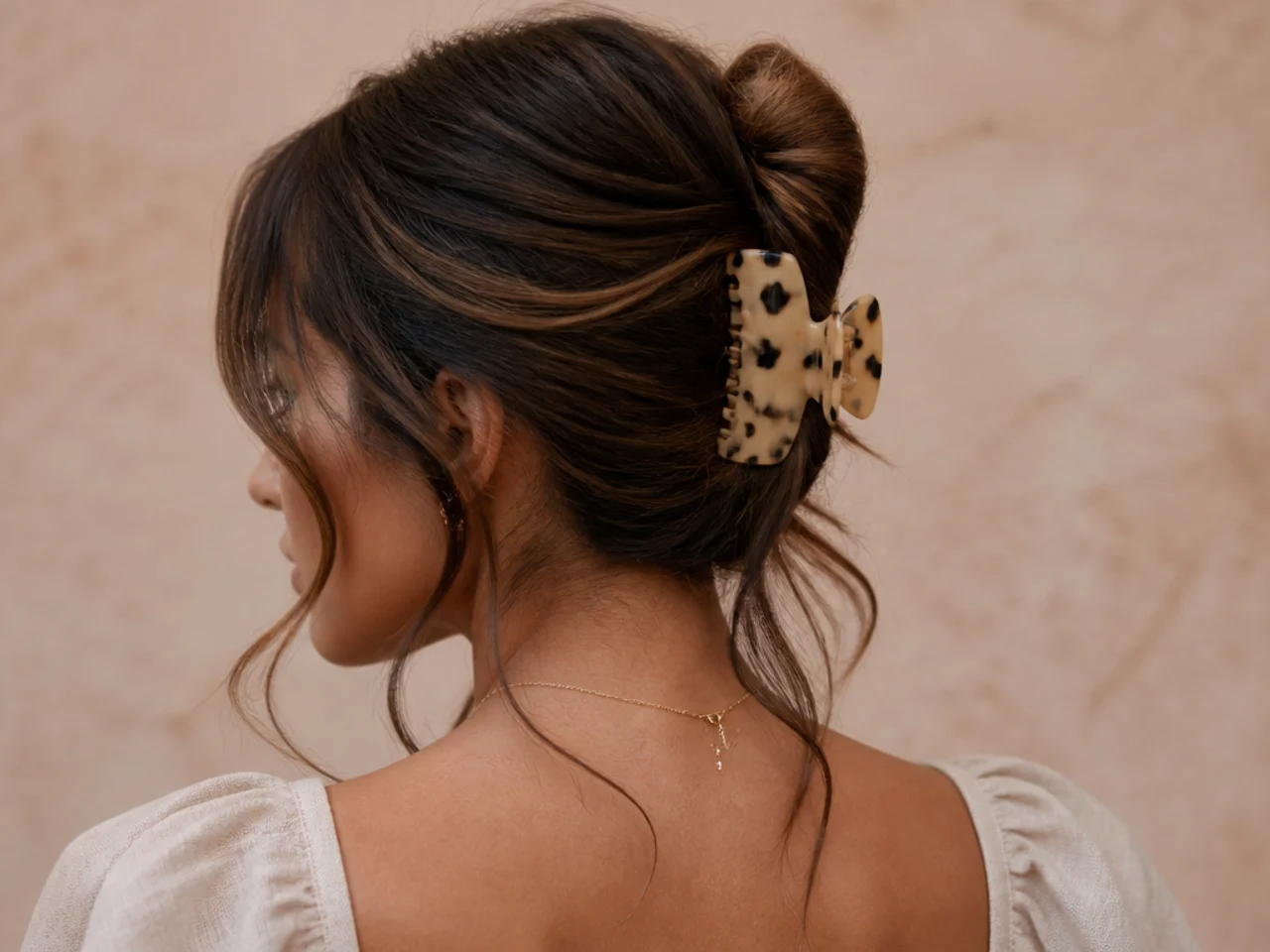 Claw clip style with face-framing pieces left loose