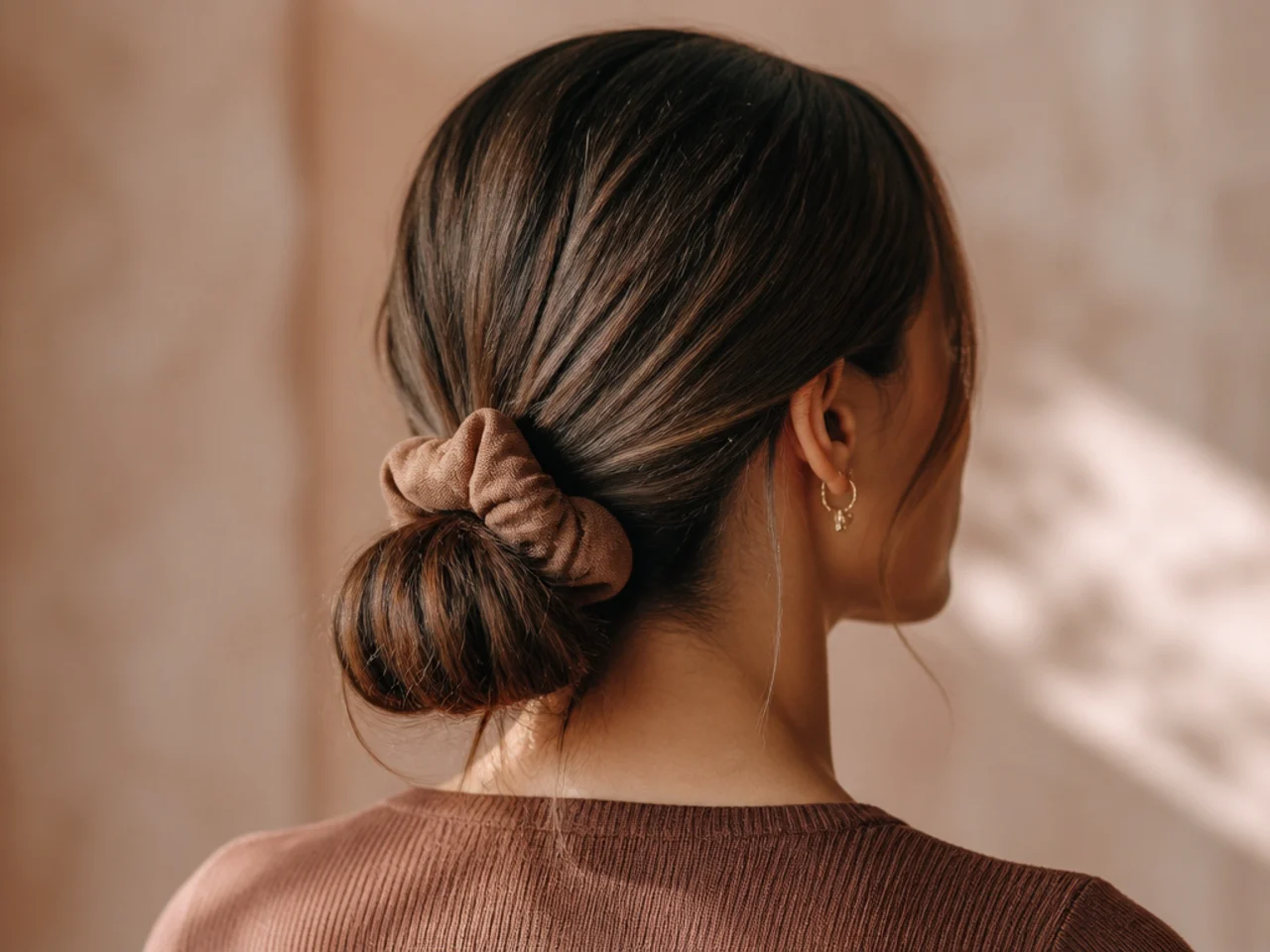 Fine hair gathered in a soft scrunchie