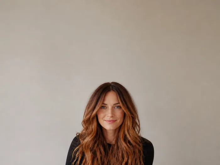 Long layered hair with molten copper balayage, glossy flowing copper waves at every layer