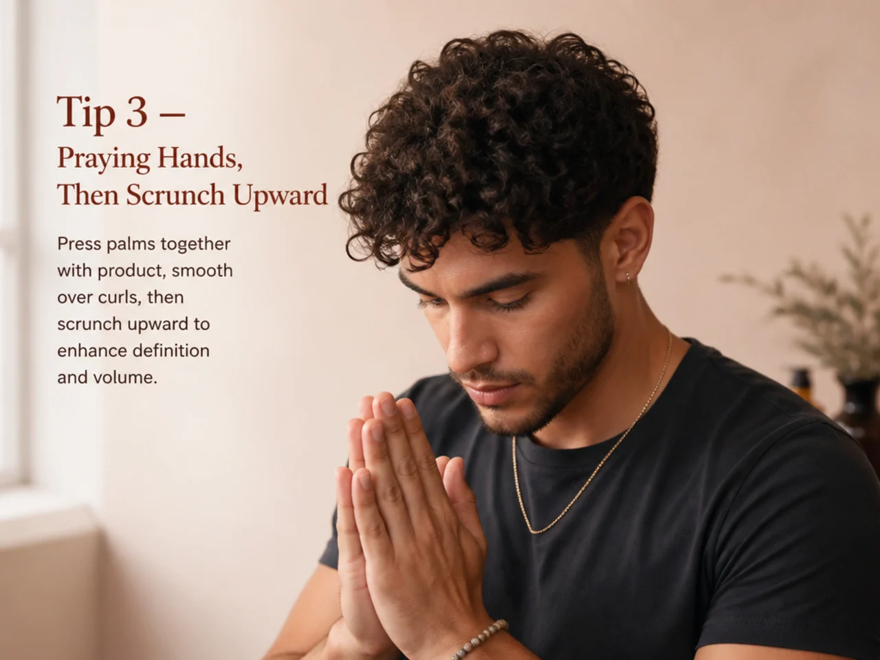 Man scrunching curly hair upward with cupped hand technique