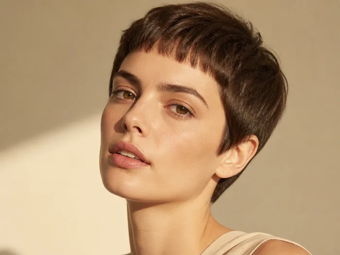 Pixie with micro baby bangs above the brow