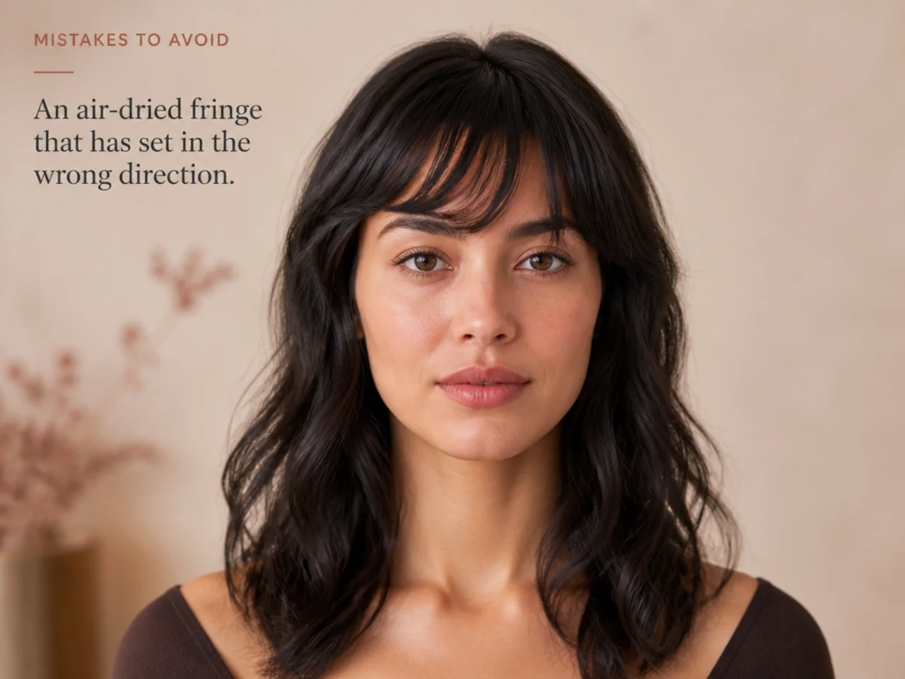 An air-dried fringe that has set in the wrong direction