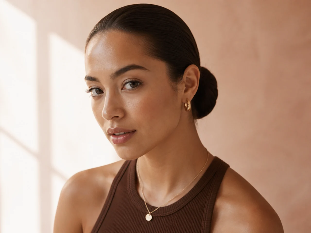A deliberately slicked-back low bun