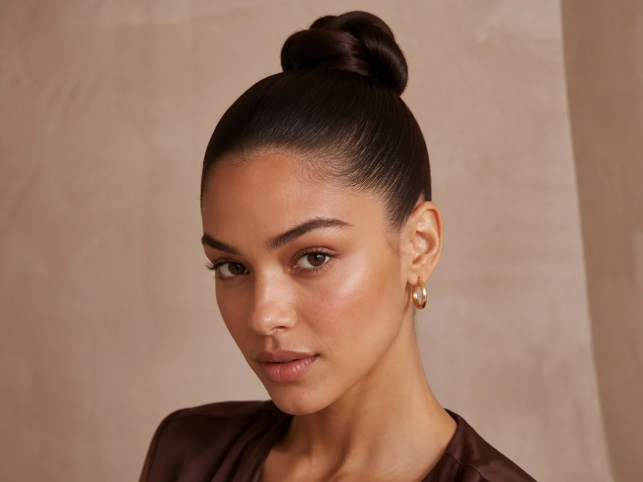 A slicked high bun