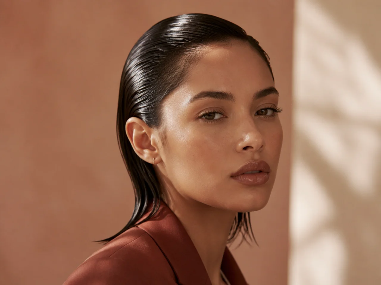 Wet-look slicked-down hair