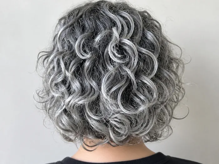Ghostly white curls Halloween hairstyle with pale silver temporary color