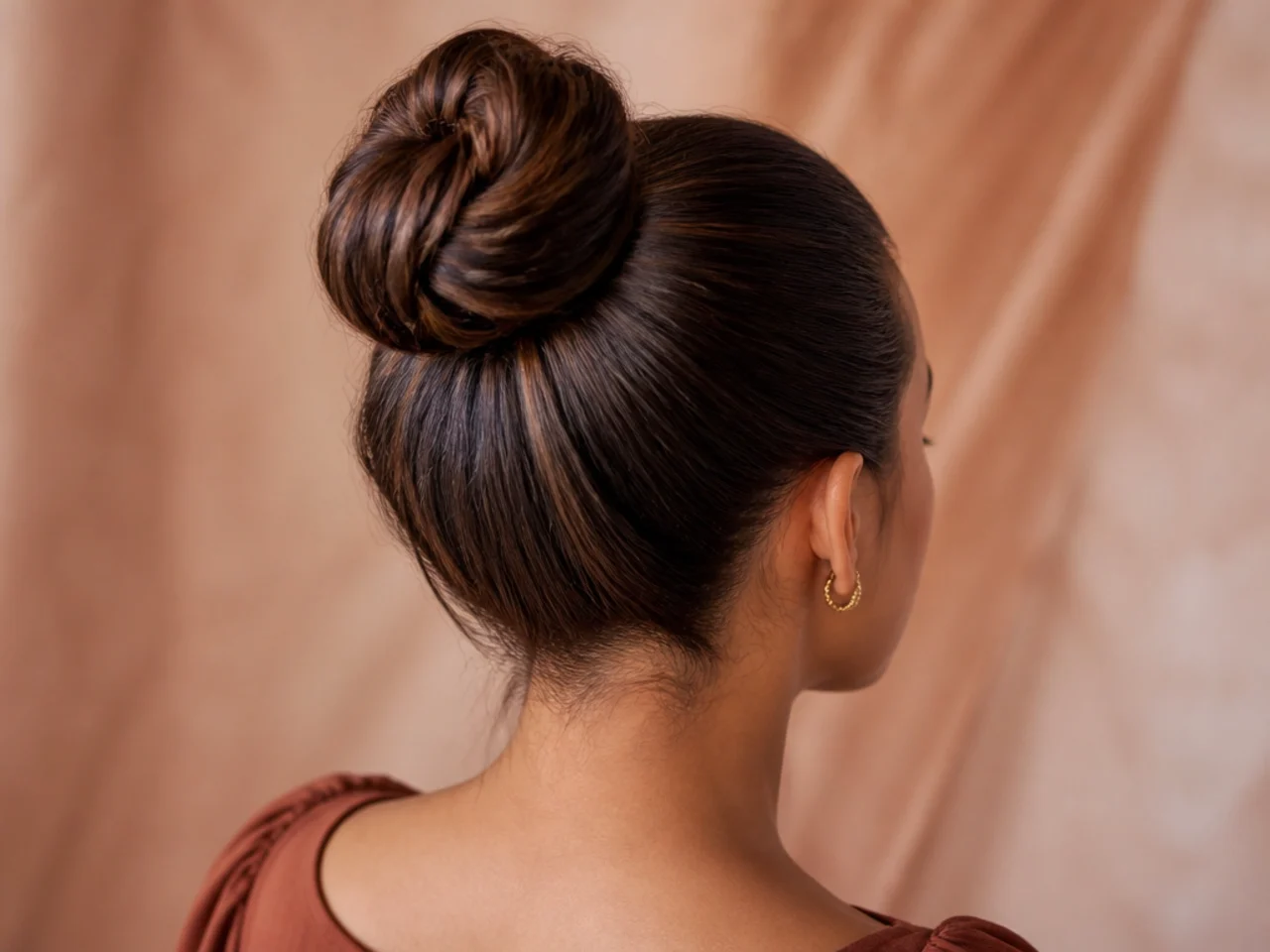 A high bun with a centre part