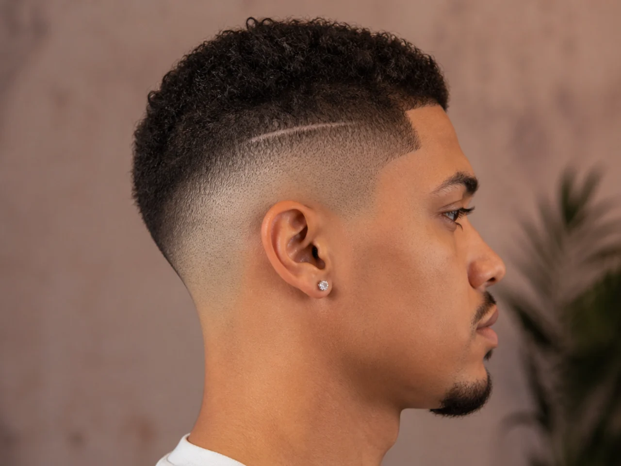 A high fade with extra length left over a scar
