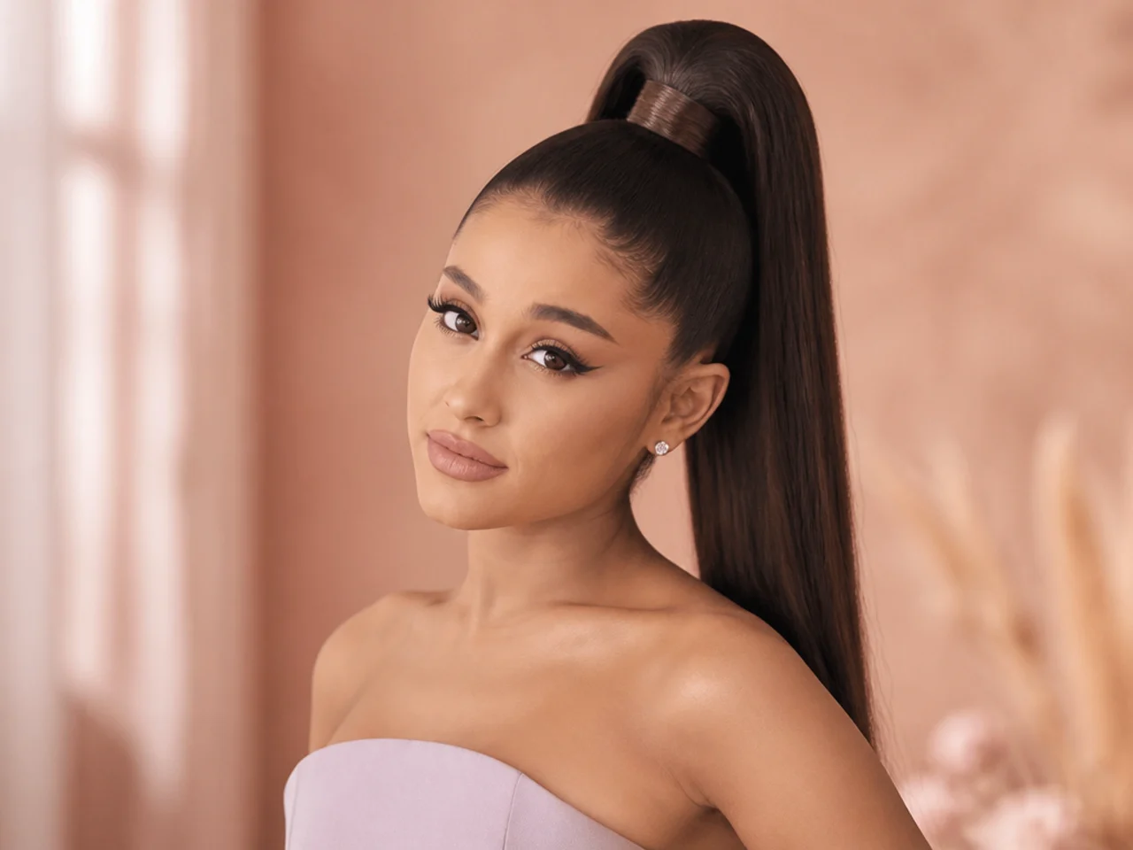 Very tall, extra-long high ponytail sitting at the crown apex with straight sleek tail