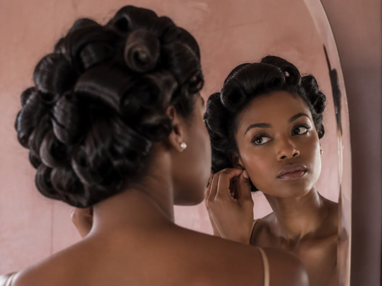 A vintage style pin curl updo with sculpted curls