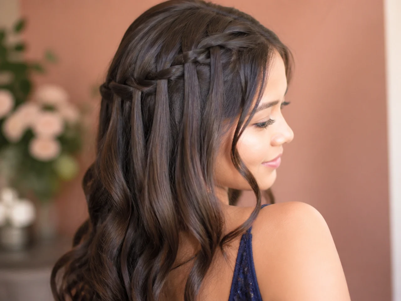 A waterfall braid with strands falling loose through the stitches