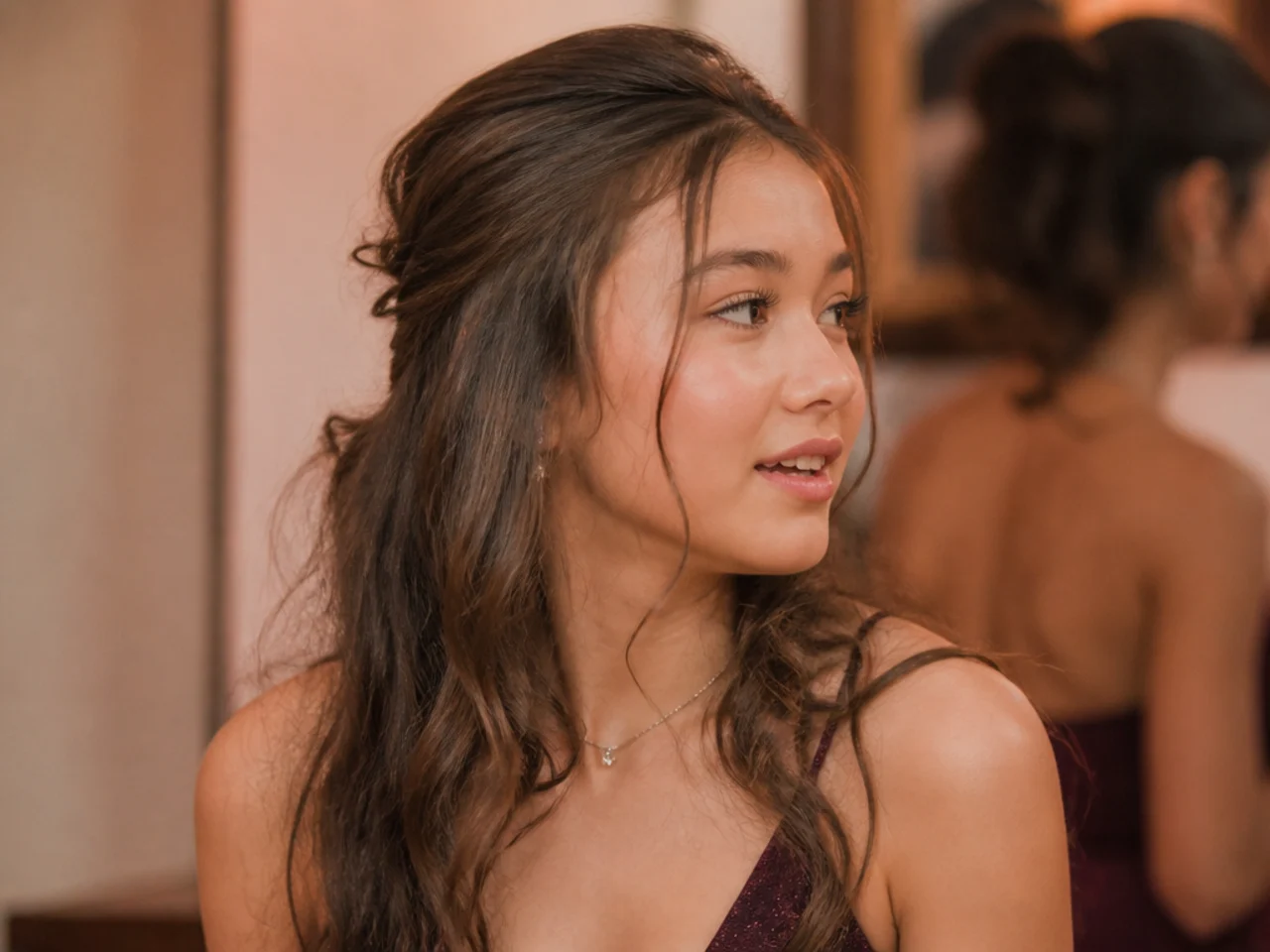 An updo taken down mid-evening leaving visible dents and bends in medium length hair