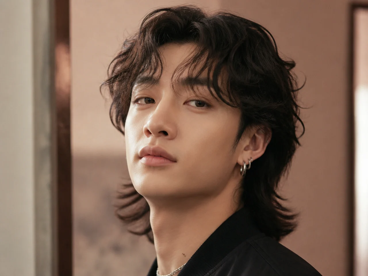 Long permed mullet with wave through the back and layered fringe on black hair