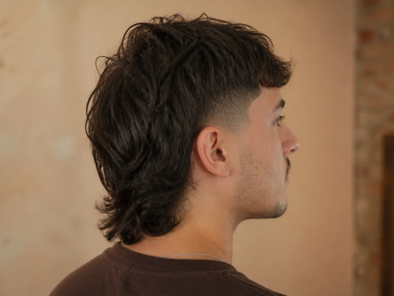 The finished shape of a long mullet fade at six months