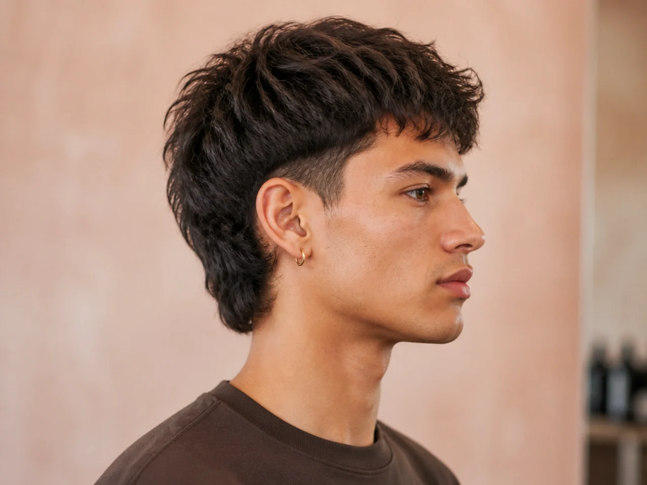 Side-profile of a short mullet showing the cropped top, tapered sides, and one-and-a-half-inch nape length