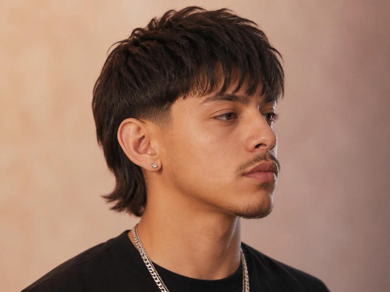 Peso Pluma fringe with blunt front and low taper fade