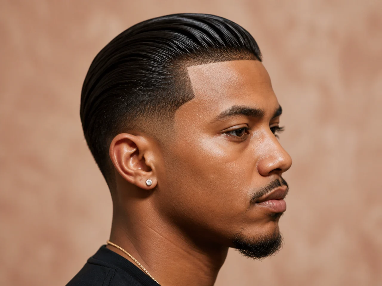 Mens slick back with razor line-up shaping the forehead and temples on a fade cut