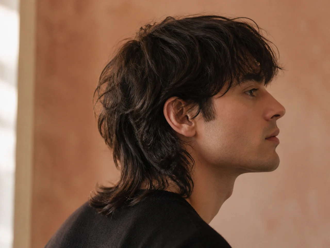 A grown out wolf cut with the nape length dominating the shape
