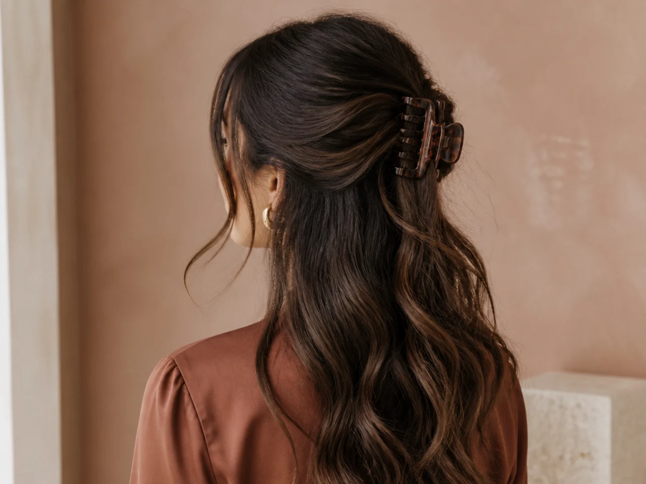 An undone half-up with released pieces