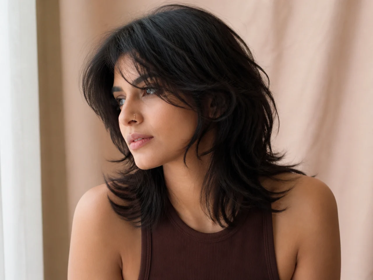 A modern mullet with face framing layers at the front