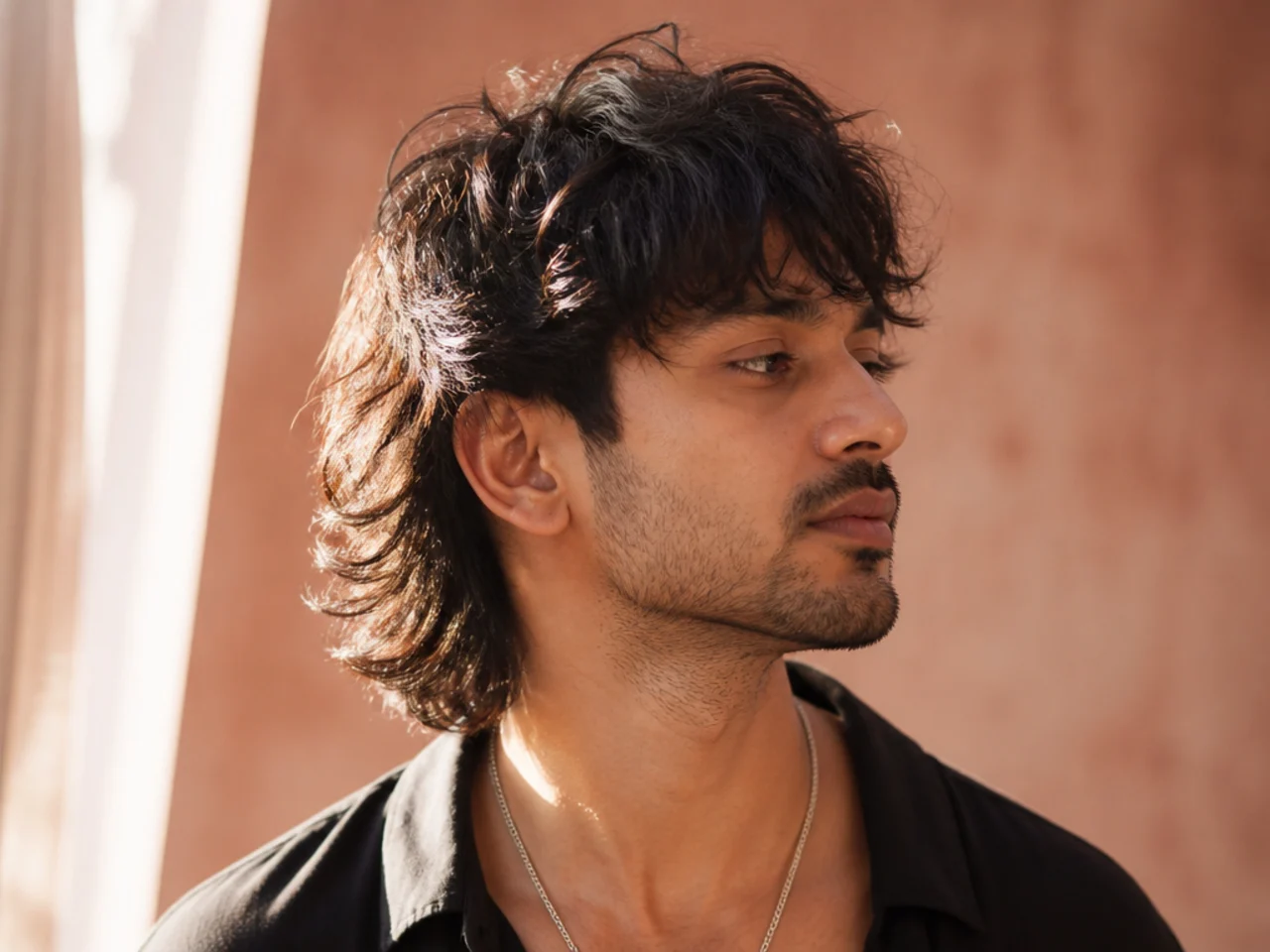 A textured mullet with point cut ends catching the light separately