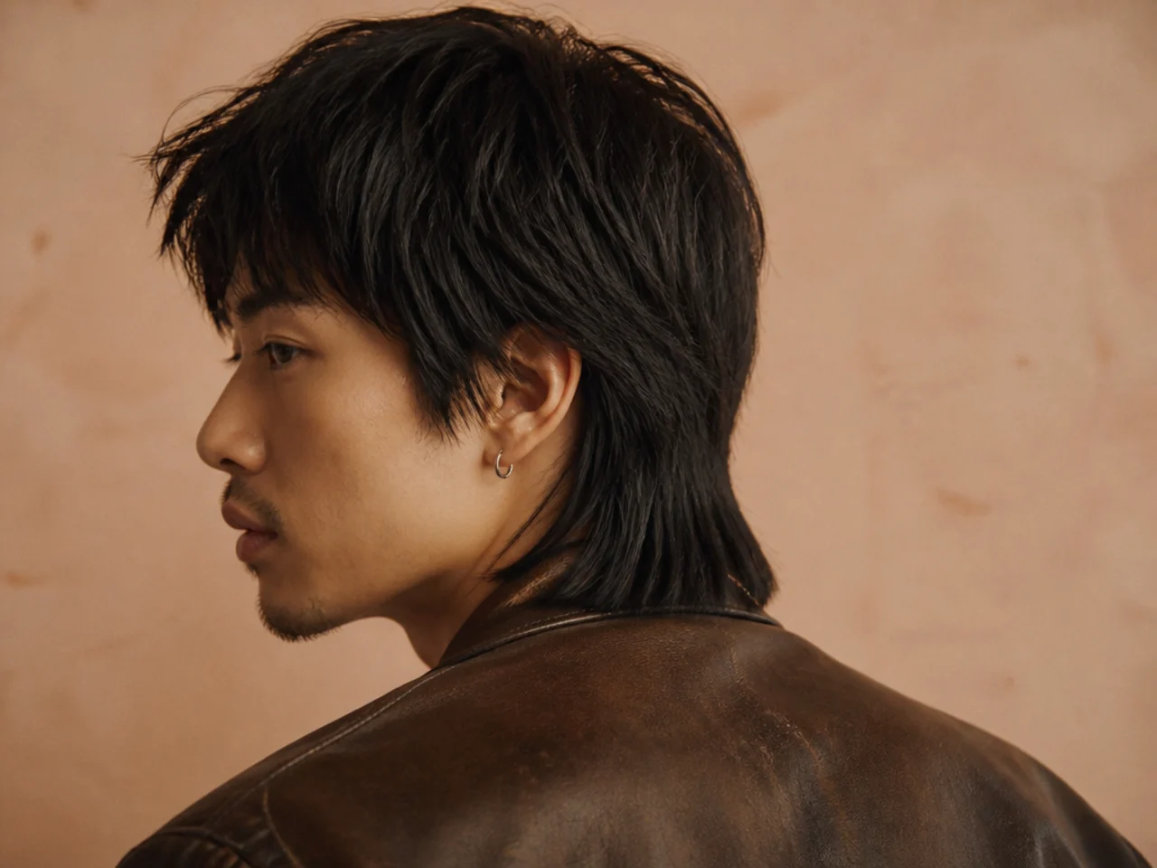 A retro style mullet with a blunt back edge