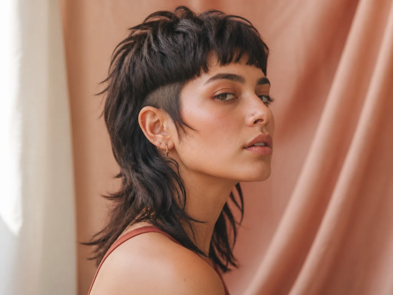 A disconnected mullet with a hard step at the sides
