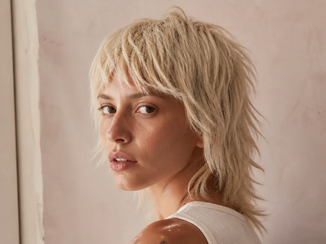 A bleached blonde mullet with choppy ends