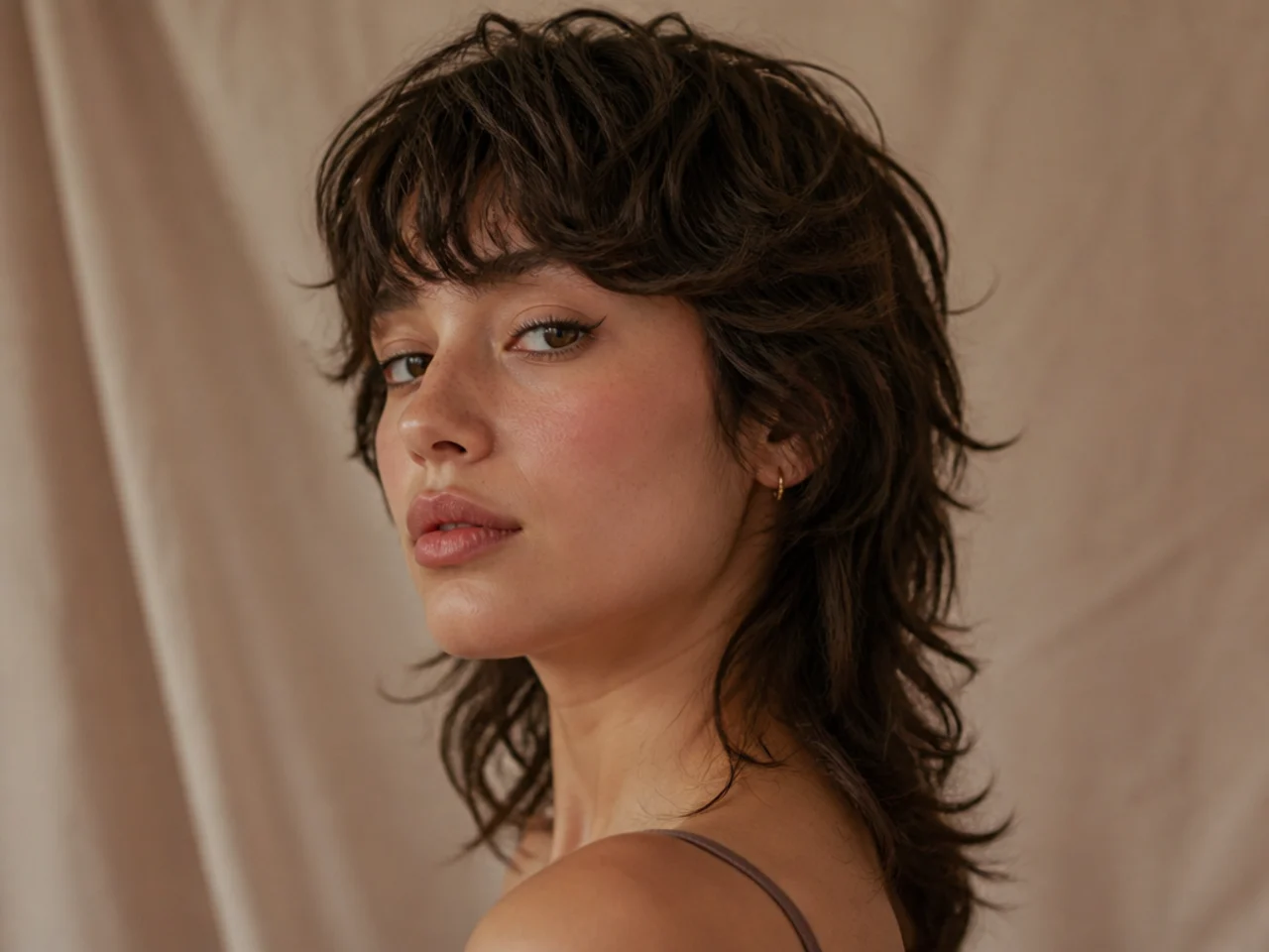 A wavy mullet with soft texture through the back