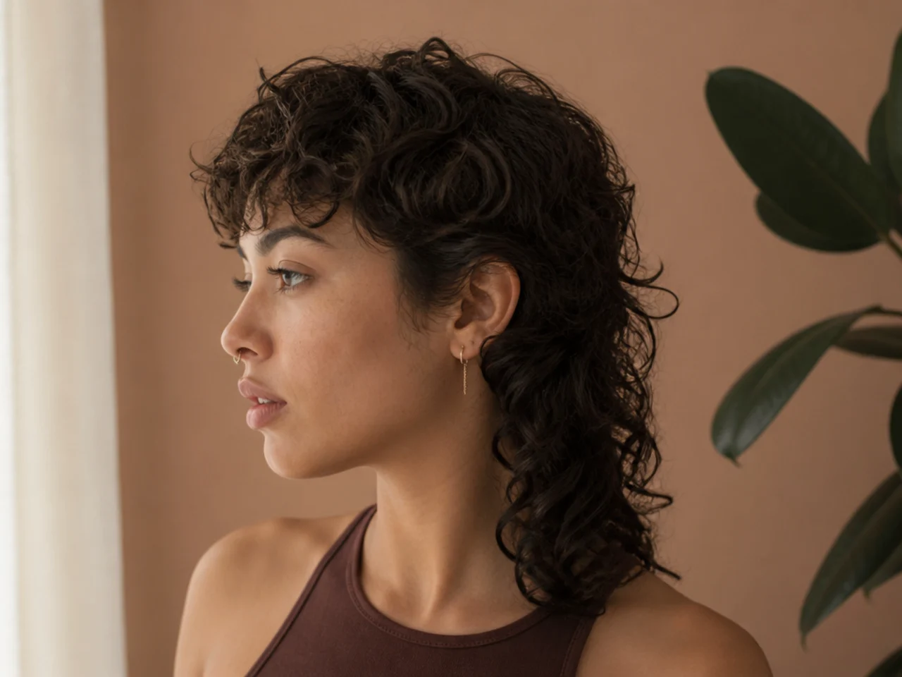 A curly beginner mullet