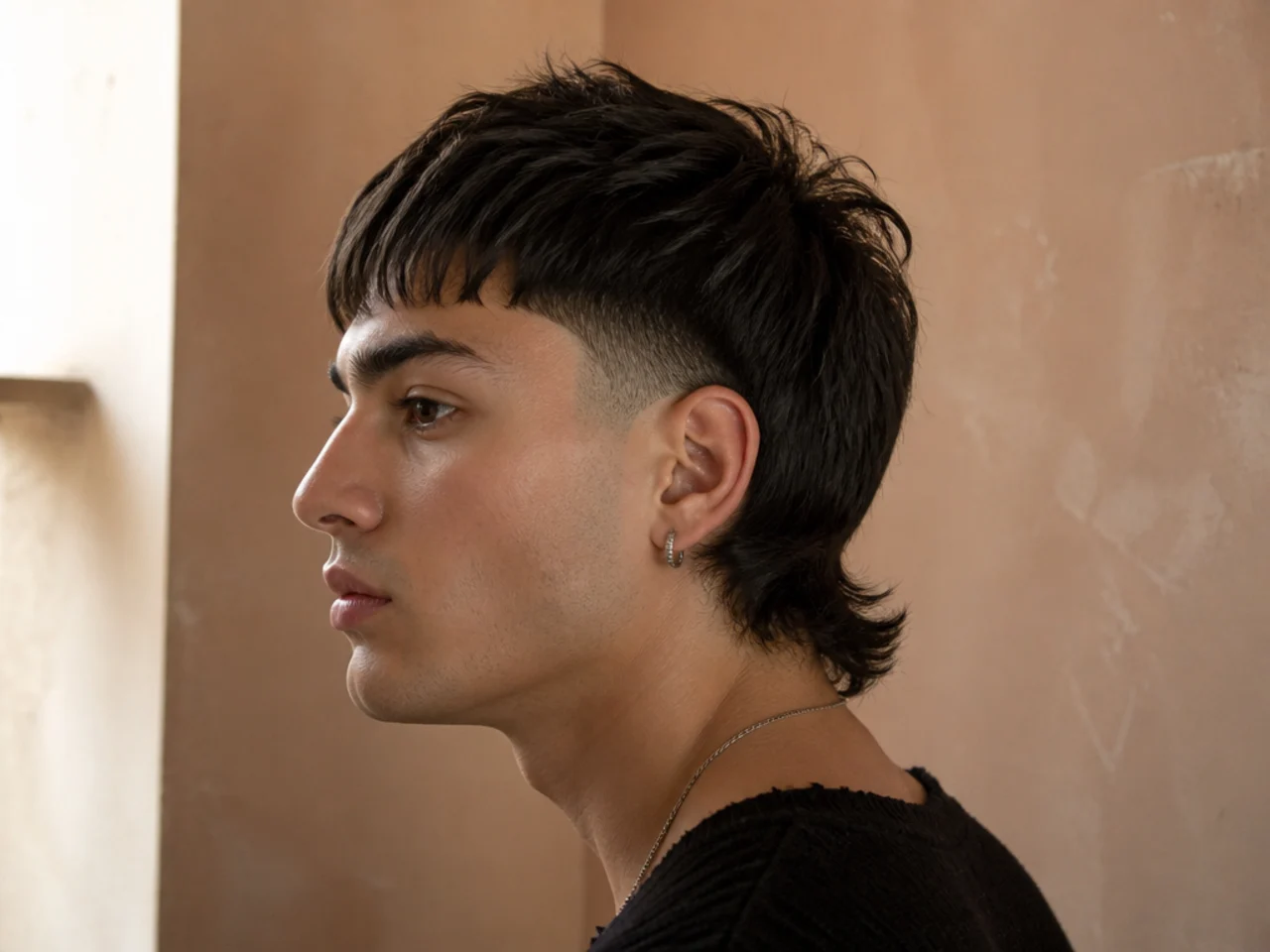 A disconnected short mullet with a hard line between tail and sides