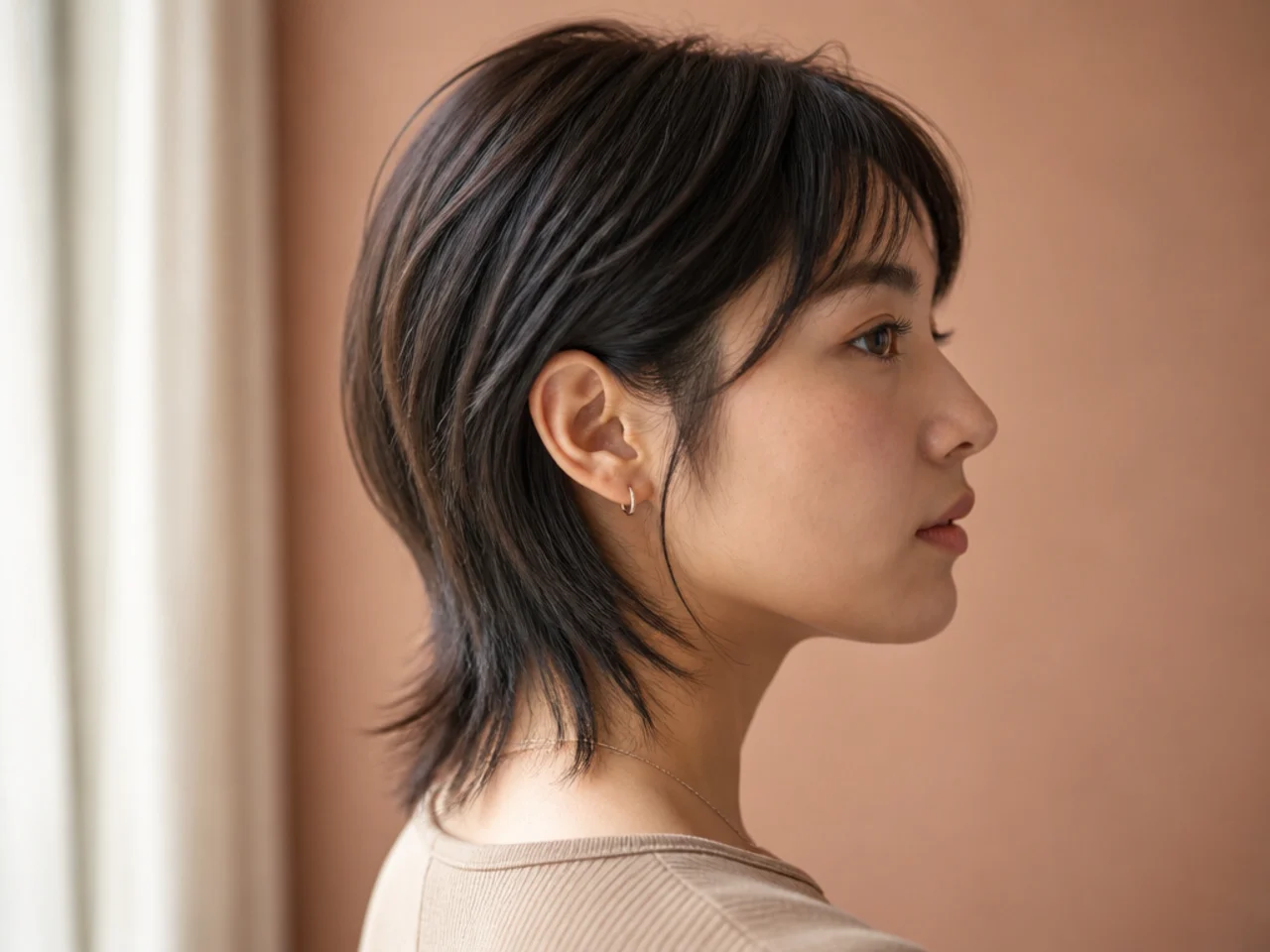 A nape length mullet on straight hair