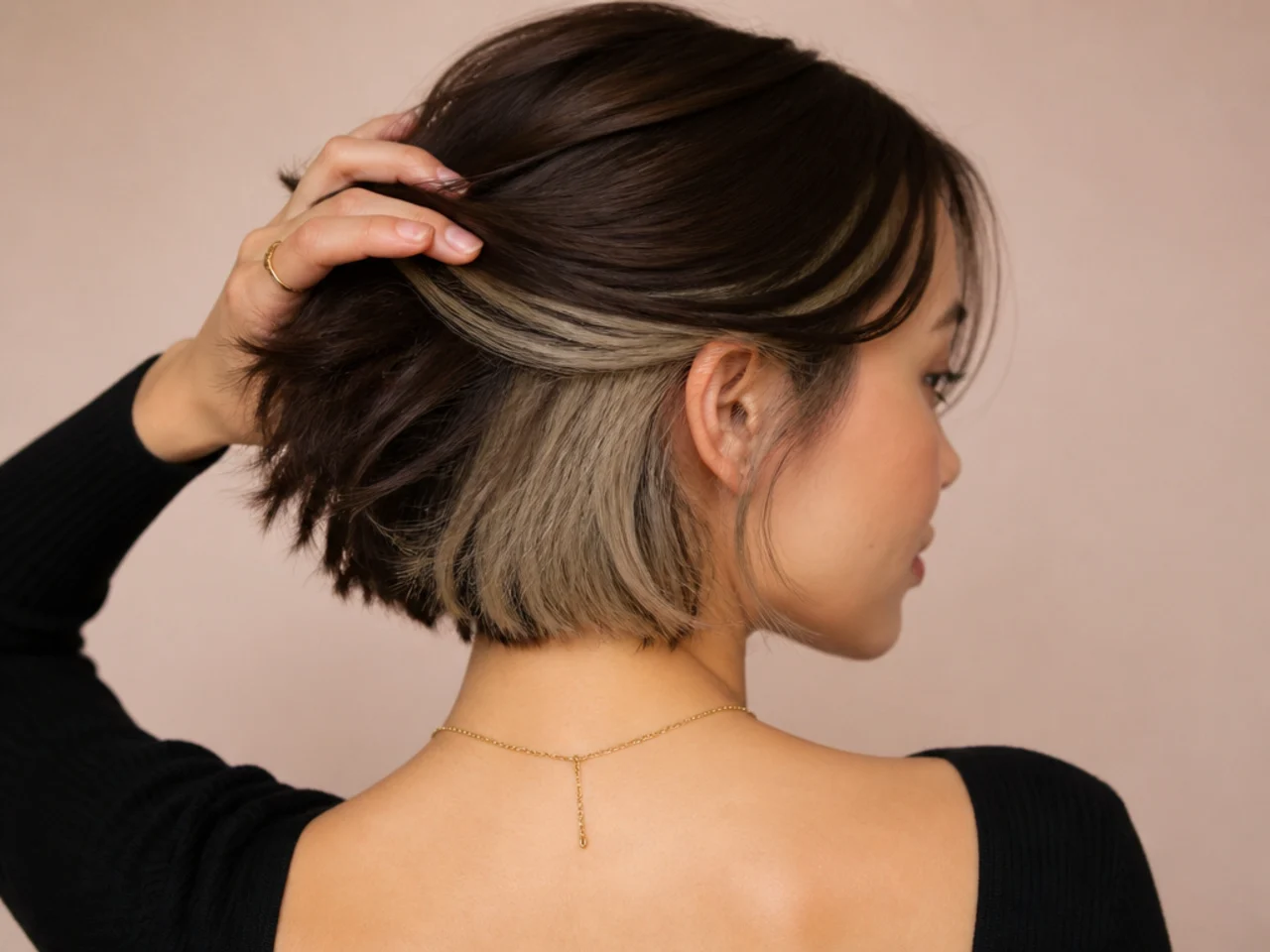 An ash blonde panel under a brown bob