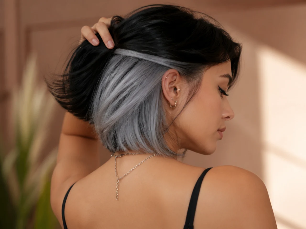 A silver panel under a black bob