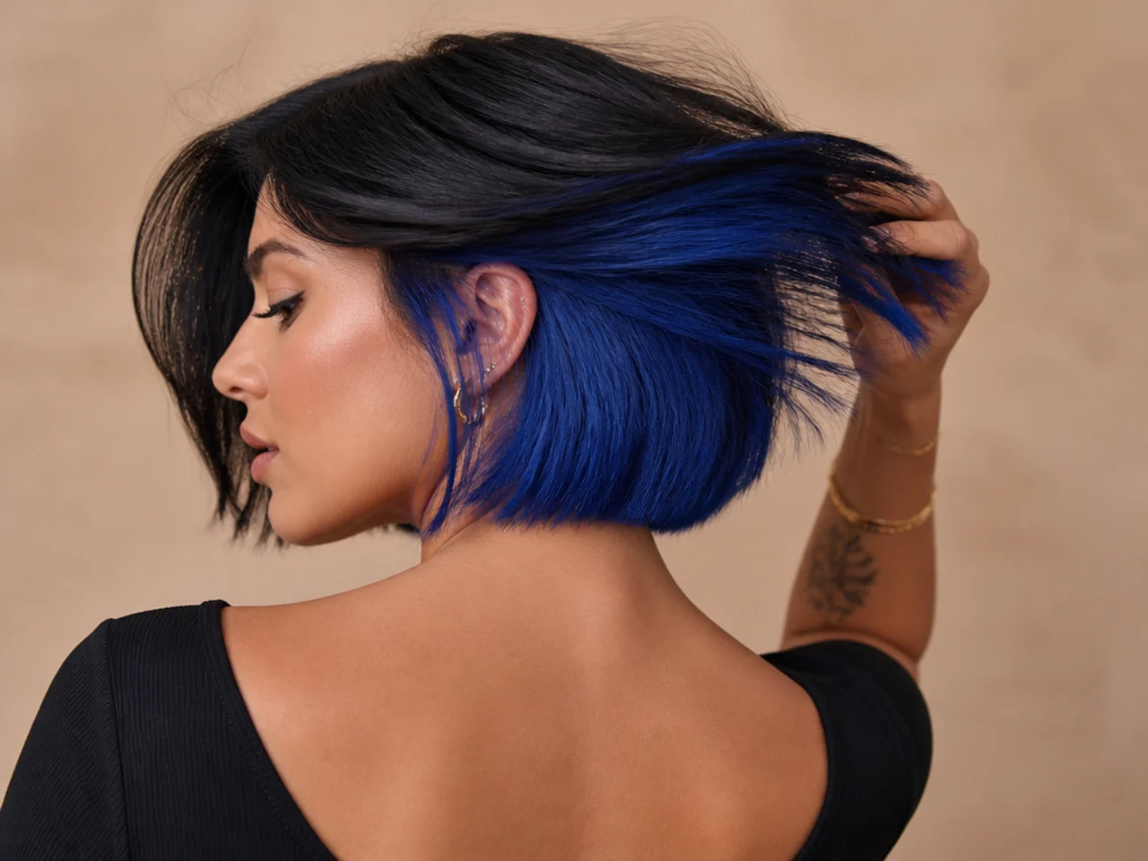 An electric blue panel under a black bob