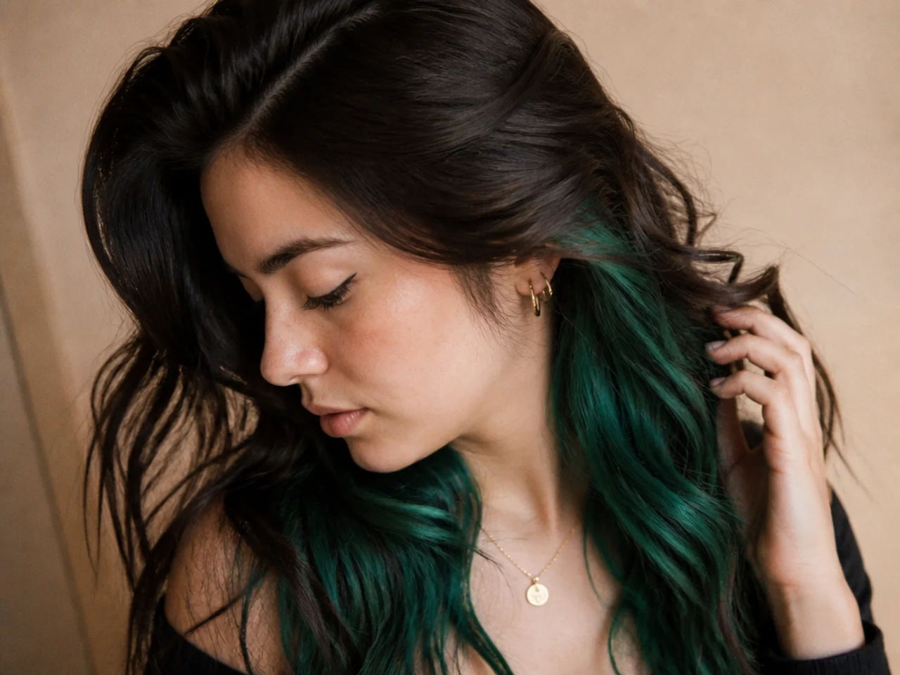 Dark brown hair with a deep emerald green underlayer