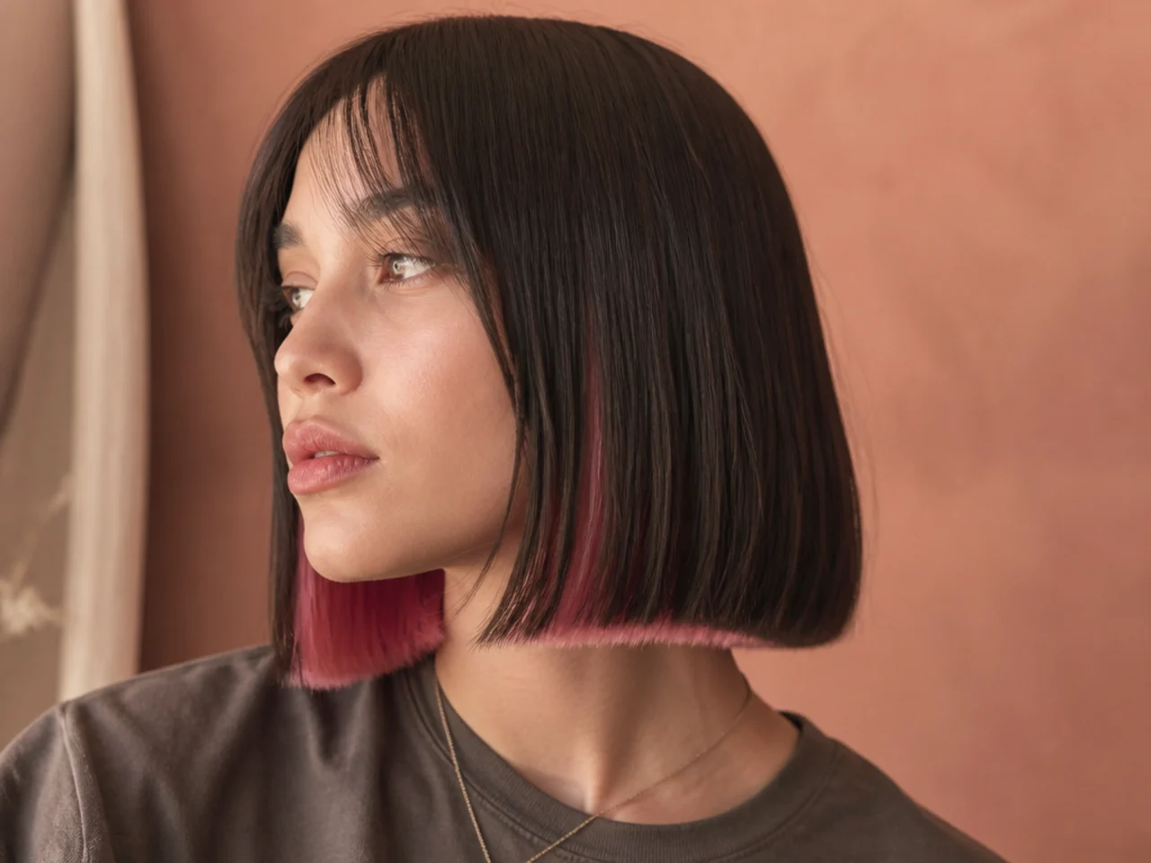 A blunt bob with pink visible along the underside of the bottom edge