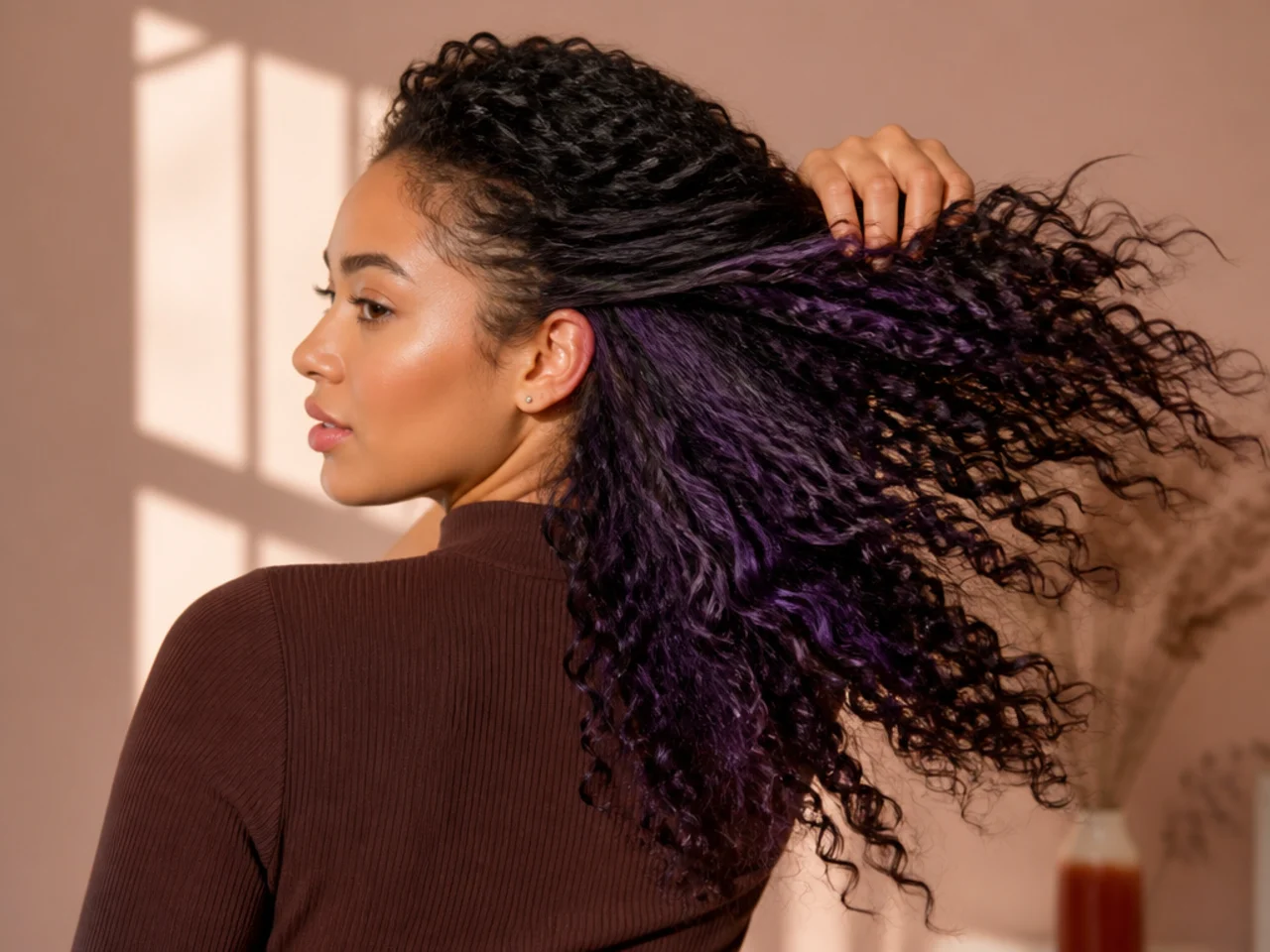 A deep violet panel on textured hair