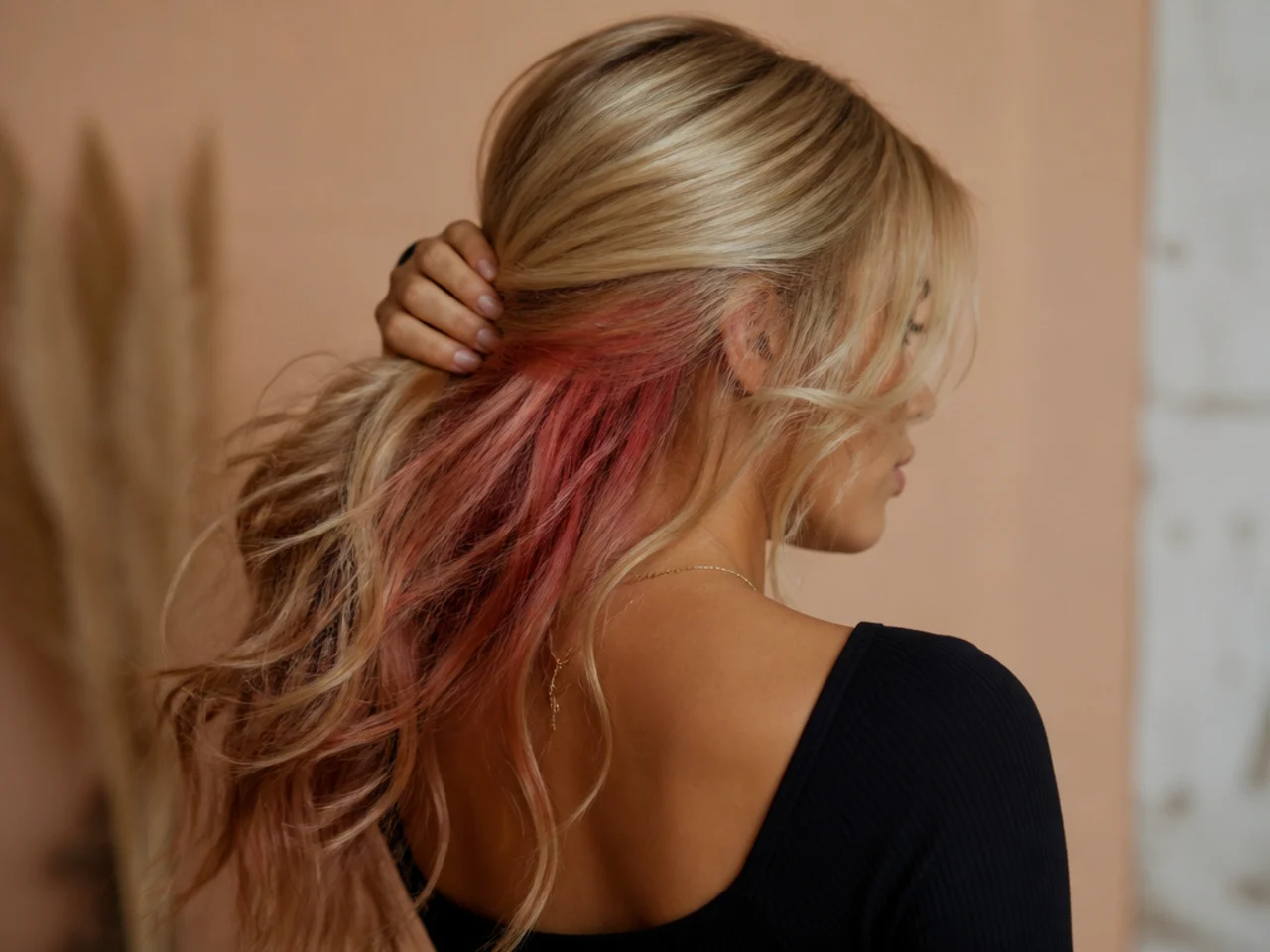 A faded and patchy vivid panel on blonde hair
