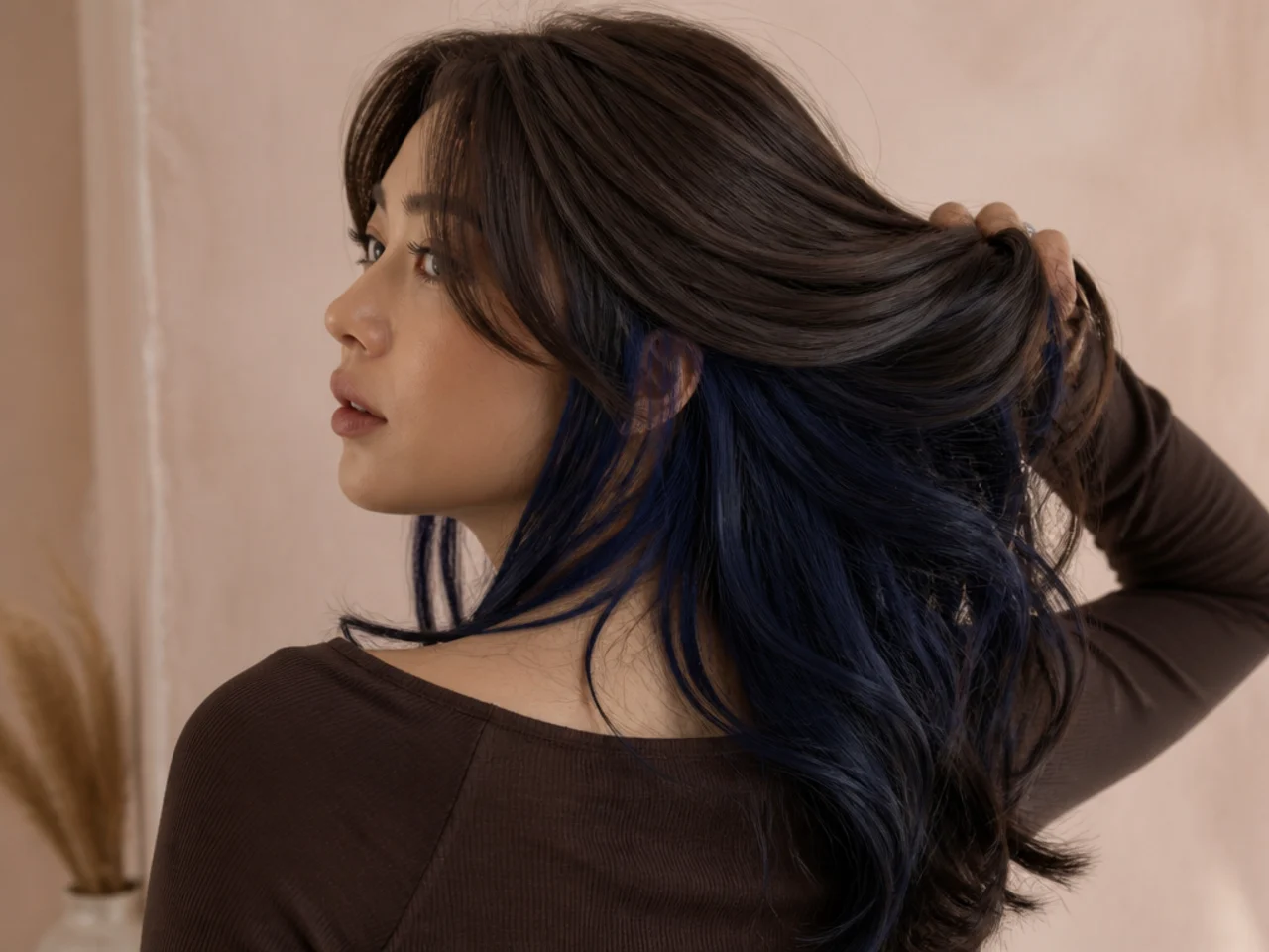 A navy panel under dark brown hair